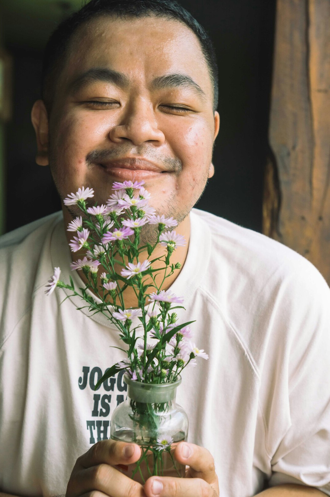 Portrait of a man in a light shirt with a friendly smile