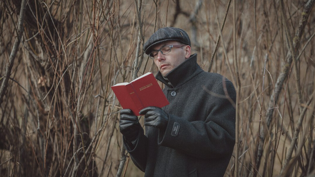 detective reading mystery book