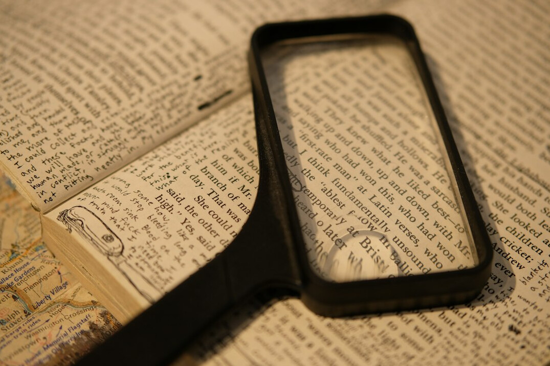 magnifying glass over book